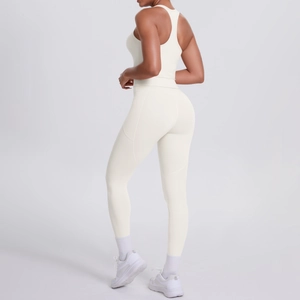 Detail view of the racerback design and high waist support on the cream yoga set