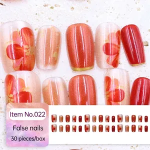 Cat eye red short press-on nails with golden floral patterns and 30-piece set box