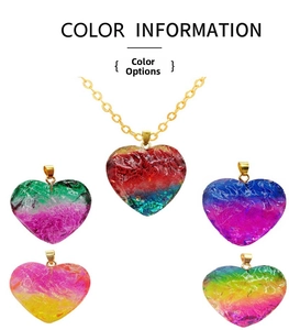 Detail showing five heart-shaped pendants with vibrant color gradients and gold loops