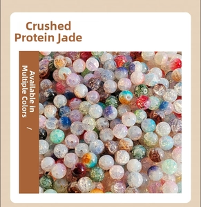 Macro shot of 10mm mixed color glass beads with internal ice crack texture for DIY jewelry