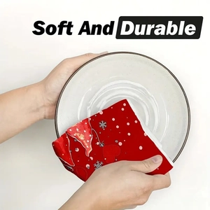 Soft and durable red microfiber Christmas dishcloth wiping a white ceramic plate