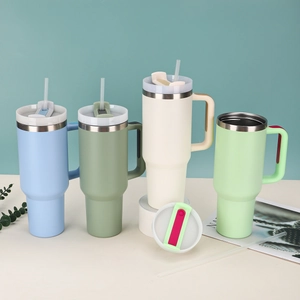 Detail of 40oz stainless steel tumblers in light blue, mint green, and beige colors