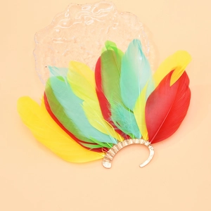 Detailed macro shot of vibrant peacock feather ear cuff with golden metallic base