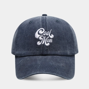 Navy blue washed cotton baseball cap with white Cool Mom embroidery in 6-panel style