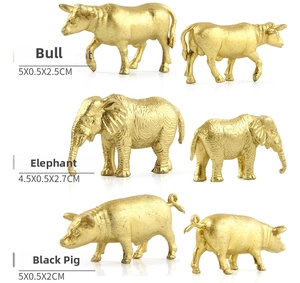 Close-up of mini gold forest animal figures showing bull, elephant and pig dimensions