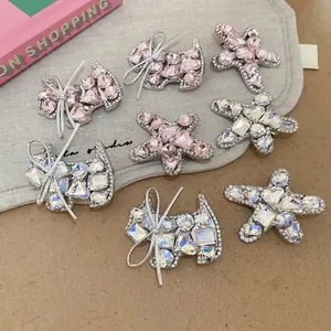 Sparkling rhinestone star and puppy hair clips with elegant silver ribbon bow accents