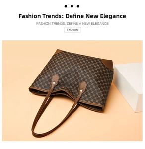 Top view of large brown vintage tote bag with retro pattern and leather handles