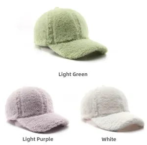 Detailed view of light green, pale purple and white plush baseball caps in soft faux fur