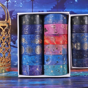 Starry sky themed washi tape set with gold foil constellations and astronaut patterns