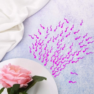 Pink and white tadpole-shaped party confetti scattered on purple background for hen parties