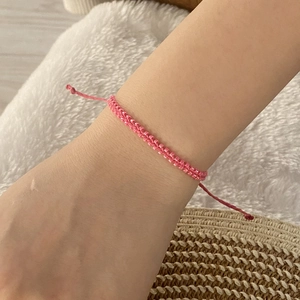 Pink bohemian woven seed bead bracelet for women with adjustable cord closure