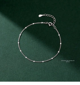 Detail of S925 sterling silver chain featuring polished round sequins and adjustable clasp