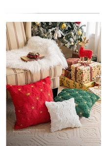 Close-up of festive Christmas pillow covers with star embroidery and plush reindeer patterns