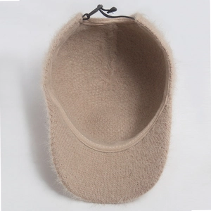 Inside view of a light brown plush baseball cap with fuzzy fur and adjustable elastic strap