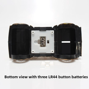 Detail view of the tractor decor bottom with LR44 batteries and red ON/OFF switch