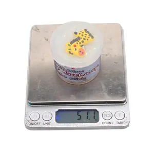 51g rice-bead slime in container with giraffe topper on digital scale for sensory play