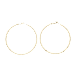 Minimalist large golden hoop earrings with textured matte finish for a stylish look