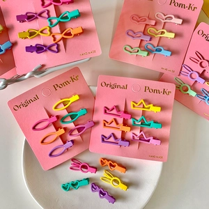 Colorful Macaron mini hair clips set with crown and heart shapes on pink card