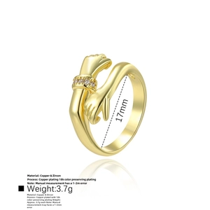 Detail showing the hug-shaped 18k gold plated ring design with zircon accents