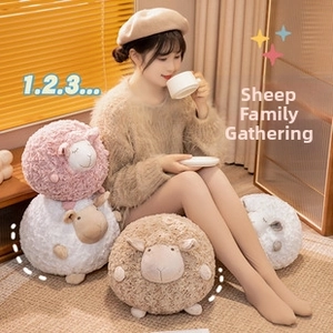 Detailed close-up of colorful sheep plush toys with curly fleece texture and cute faces