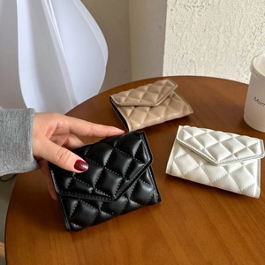 Quilted foldover mini wallet set in black beige and white faux leather finish
