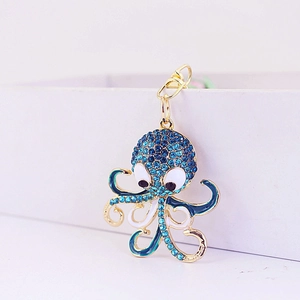Golden octopus keychain with sparkling blue rhinestones and lobster clasp accessory