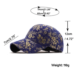 Navy denim baseball cap with gold floral pattern and detailed size specifications
