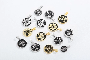 Various circular stainless steel pendants with Tree of Life and Clover patterns