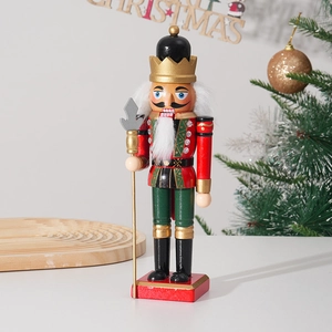 Classic 25cm wooden nutcracker soldier in red uniform with gold crown on festive background