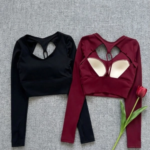 Detail of yoga tops with hollow-out back design and removable pads in black and wine red