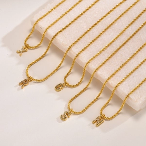 Gold plated titanium steel snowflake chain with sparkling cubic zirconia 26 letters pendant