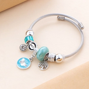 Silver twisted bangle with blue butterfly charms and sparkling cubic zirconia stones