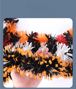 Close-up of 2m Halloween tinsel garland showing plush black and green fringe texture