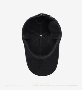 Detail view of winter baseball cap interior lining with stitching and metal buckle