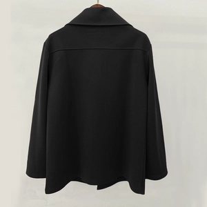Rear view of long sleeve black trench coat with classic lapel collar and clean stitching