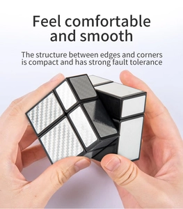 Close-up of silver mirror cube with carbon fiber stickers showing its compact structure