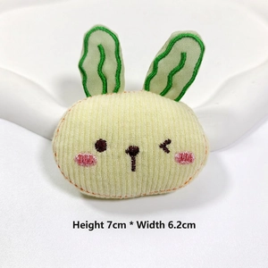Close-up of yellow striped rabbit plush accessory measuring 7cm in height and 6.2cm in width