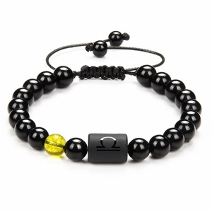 Detailed shot of Libra zodiac bracelet with black agate beads and yellow crackle stone