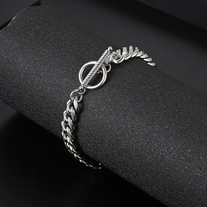 Silver titanium steel Cuban link bracelet with OT toggle clasp on a dark display