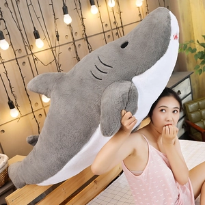 Detailed view of giant grey plush shark skin with soft texture and side gill embroidery