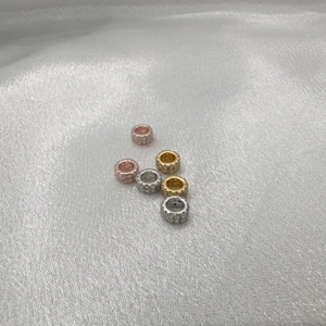 Macro shot of S925 silver double-row zircon ring beads in rose gold, gold and silver finishes