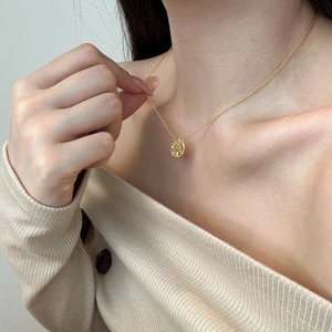 Minimalist S925 sterling silver necklace with textured gold coin pendant on model