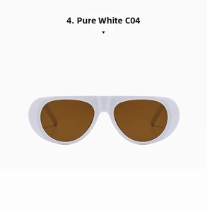Detail view of bold white oversized sunglasses with premium amber-tinted lenses