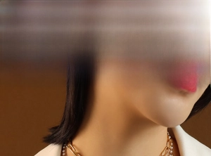 Detail of layered gold chain necklace with pearls on model neck in chic fashion style