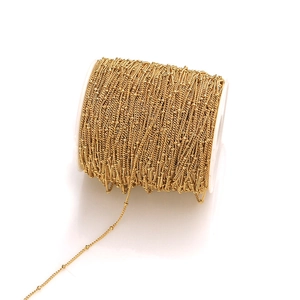Close-up of golden stainless steel satellite bead chain roll for DIY jewelry making