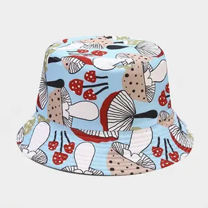 Detail of light blue bucket hat featuring colorful mushroom patterns on cotton fabric
