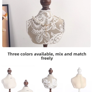 Detailed close-up of pearl necklace on various mini mannequin jewelry display stands