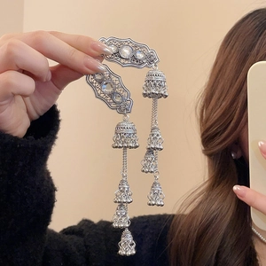 Ethnic style silver Jhumka earrings with gemstones and layered bell tassel charms