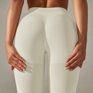 Detail of high-waist seamless knitted yoga leggings with peach butt lifting effect