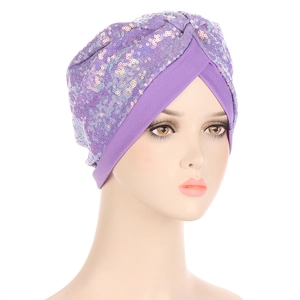 Detail of lavender purple sequin turban cap with front cross pleats on a white background